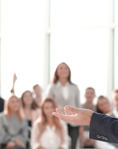 close up. speaker standing in front of the audience in the conference room. photo with copy space